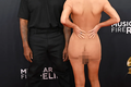 BLUR-Kanye-West-Keeps-It-Casual-at-2025-Grammy-Awards-While-Wife-Bianca-Censori-Poses-in-Sheer-Dress-3